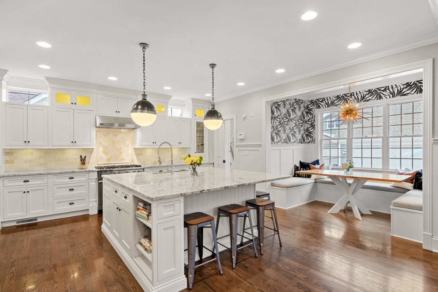 Professional real estate photo of the modern and spacious kitchen with a seating area in the house for sale in Chicago
